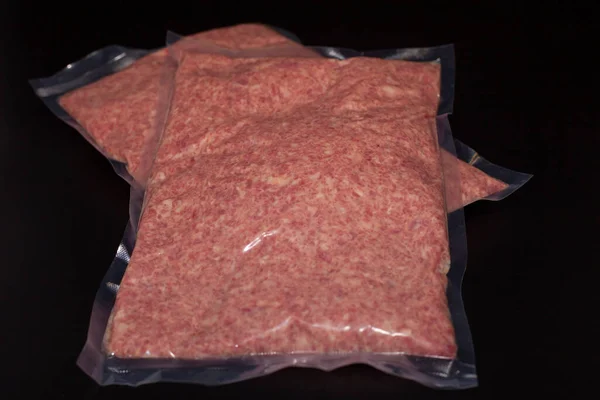 Minced turkey meat in a package. Fresh meat with herbs and spices. Organic delicious titanium meat