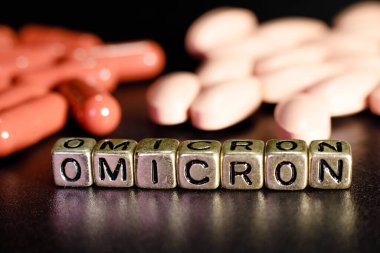 Omicron antiviral hapları. Antiviral ilaçlar. Harflerden yazılan omikron