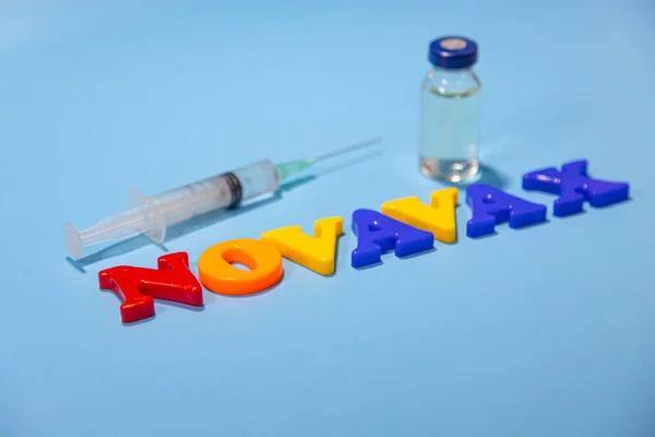 Novavax company logo. Letters with the name of antivirus for children with tilt and shift effect. High angle photo, soft focus.