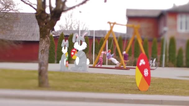 Children City Rocked City Swing Street Decorated Rabbits Artificial Eggs — Stock Video