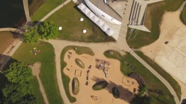 Aluksne lake shore with boat dock and playground