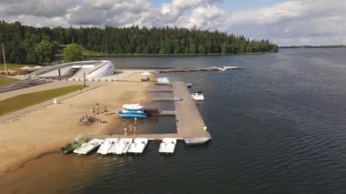 Aluksne lake shore with boat dock and playground