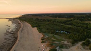 Sun setting reflection on seascape. Tropical golden sunset over ocean water aerial view. Calm waterscape at sunny evening.
