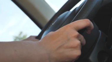Using Windshield Wiper Car Wheel. Woman Driver Hand On Car Steering Wheels. Transport Driver Turning Steering Wheel Car. Business woman driving a car.