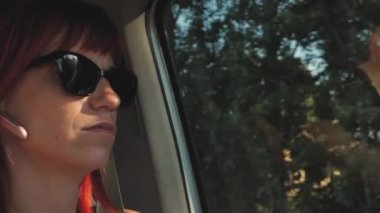 Business woman driving a car. Attractive Smiling Business Woman Driving a Car. Caucasian pretty woman driving a car by her street and smiling. Portrait of a young woman driving a car.