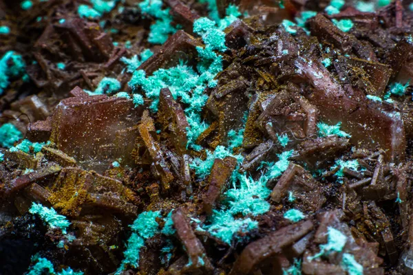 Real brown albite crystal cluster with small light green malachite clusters isolated on white. Macro