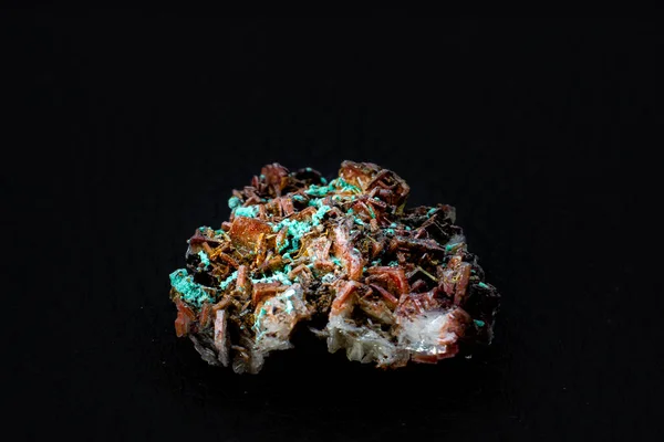 Real brown albite crystal cluster with small light green malachite clusters isolated on black. Macro