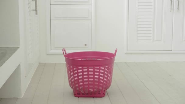 Dirty clothes falling into the laundry basket. — Stock Video
