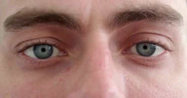 A beautiful insightful look blue mans eye. Close up shot.