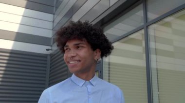 Curly haired African American man, close up.