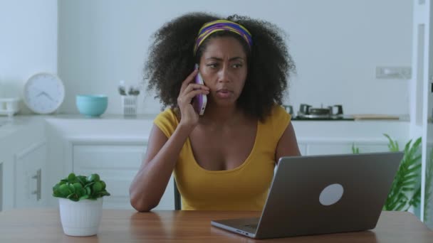 Multitasking Multi Ethnic Young Woman Freelance Worker Works Laptop Talking — Stockvideo