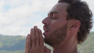 Personal spiritual growth, mindfulness, harmony, achievement, motivation, self-improvement. Confident man saying prayers