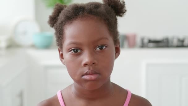 Close Portrait Serene African American Little Girl Wearing Bright Pink — Stockvideo