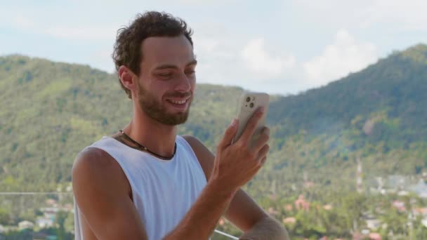 Portrait Smiling Bearded Man Standing Balcony Looking Phone Screen Talking — Vídeo de Stock