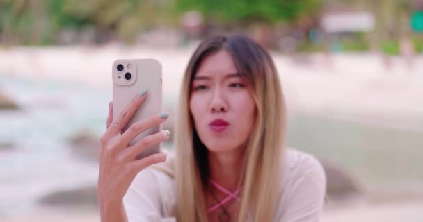 Millennial Asian Woman Talking Looking Mobile Phone Camera Sitting Close — ストック動画