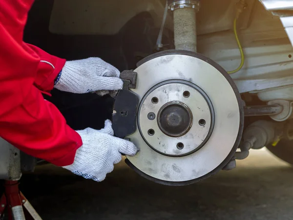 Process of replacing brake pads with Brand new. Auto mechanic repairing in garage Car brakes. Car Maintenance checklist.