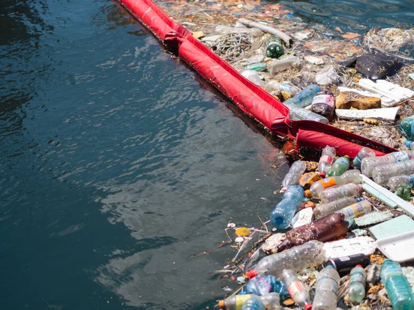 People do not recycling plastic. World ocean pollution. Throwing garbage on the seashore. Zero waste concept.