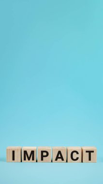 IMPACT word on wood blocks concept. Business improvement, personal development, and growth concept. IMPACT word written on wooden cubes. IMPACT word written on wooden blocks. Business concept