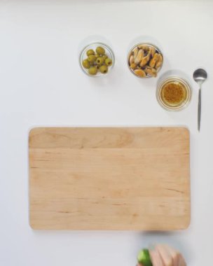 Close up footage of a woman hand chef, prepares a salad of seafood and vegetables