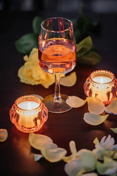 Glass Rose Wine Two Candles Rose Petals Dark Table Nice — Stockfoto