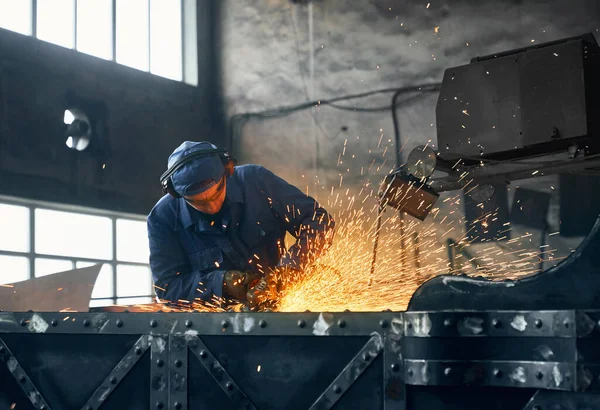 Craftsman processing with metal sheet at workshop — Stock Photo, Image