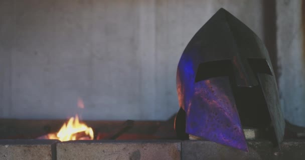 Helmet of medieval times being forged in smithy. — 비디오