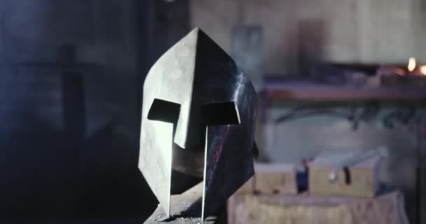 Blacksmith forging knight mask, helmet. — Stock video