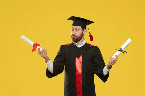 Student with beard graduating from college, university. — Photo