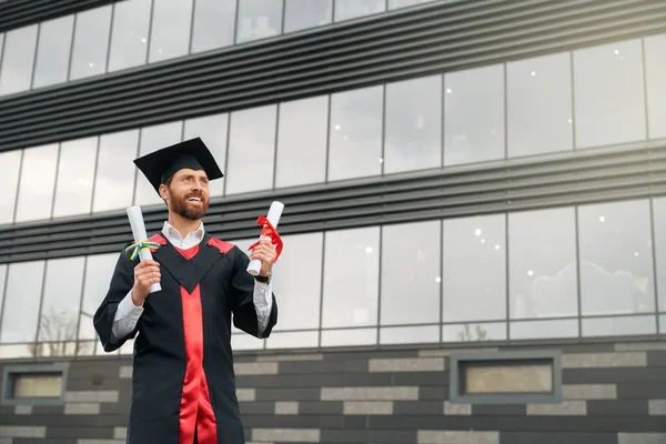 Student with beard graduating from college, getting degree. — Foto Stock