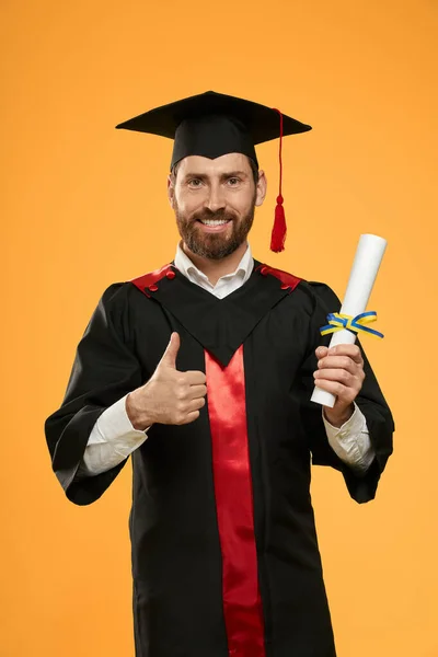 Male with beard graduating from college, university. — Stock Photo, Image