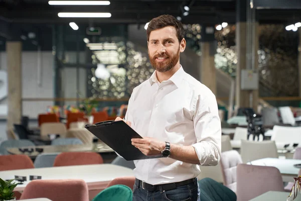 Front View Brunette Male Beard Standing Holding Folder Furniture Store — Stock Photo, Image