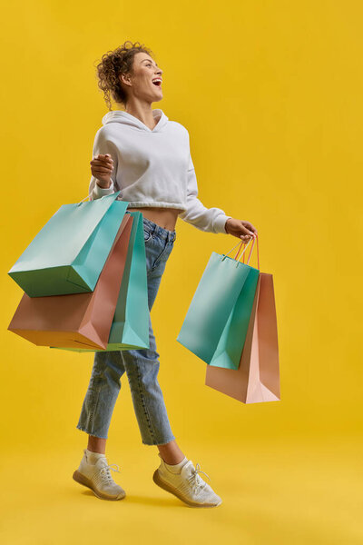 Pretty Woman Carrying Shopping Bags Walking Studio Front View Cute Royalty Free Stock Photos