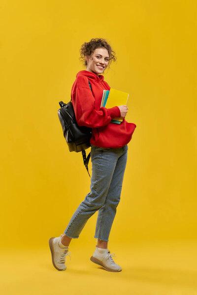 Female Student Backpack Books Standing Tiptoe Shyly Bent One Leg Stock Picture