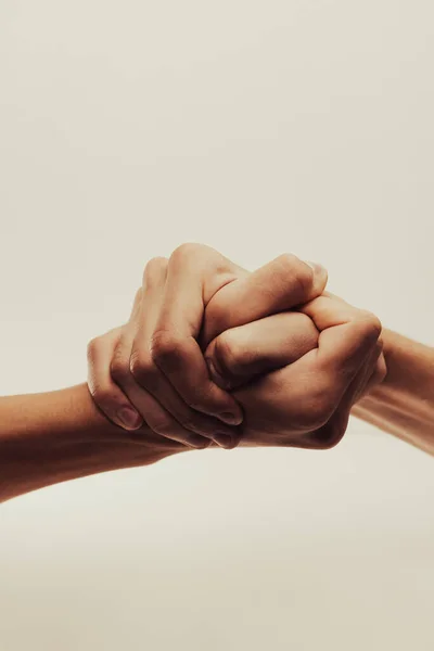 strong male handshake with bare hands on a white background