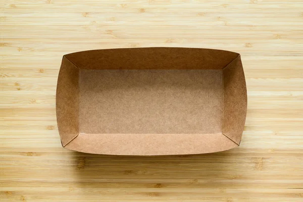 Ahşap Bir Arka Planda Yiyecek Için Boş Karton Kutu Yukarıdan — Stok fotoğraf