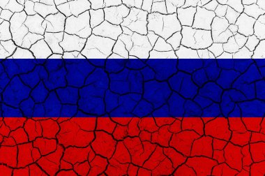 Kırık kuru toprak dokusunda Rusya Federasyonu bayrağı.