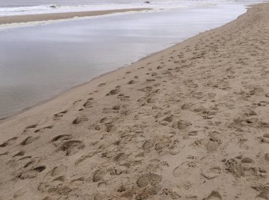 Güzel ada Sylt 'in kumsalında ayak izleri, Westerland plajı, kuzey denizi.