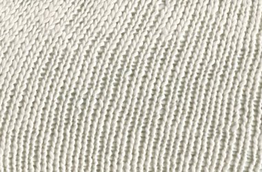  Sıcak, beyaz, el yapımı süveter arka planı. Beyaz örgü arka plan.