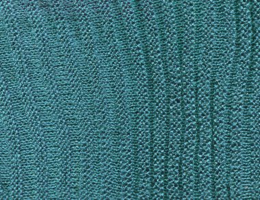 Kopya uzayı ile boho dokuma tuval doğal lacivert dokusu. Yumuşak stilde mavi yeşil yünden süveter.