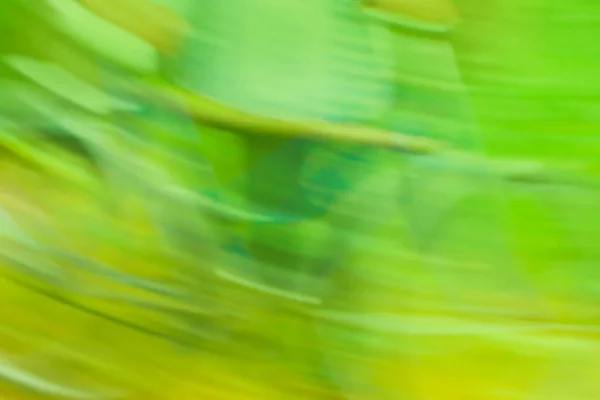 Bicycle blurred bokeh background. Bike is moving fast blur defocused bokeh background. Blurred  bike driving on a bike path.