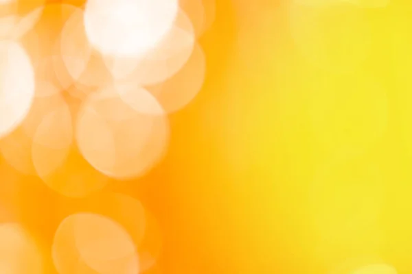 Blurry yellow orange color bokeh backdrop. Orange and yellow bokeh.