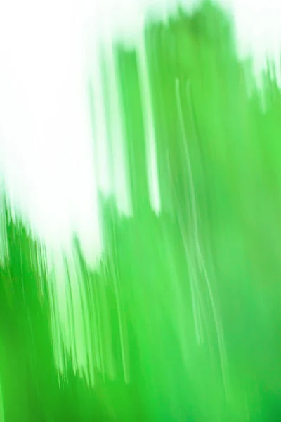 Long time exposure motion green blur. Fast speedy motion blur green background.