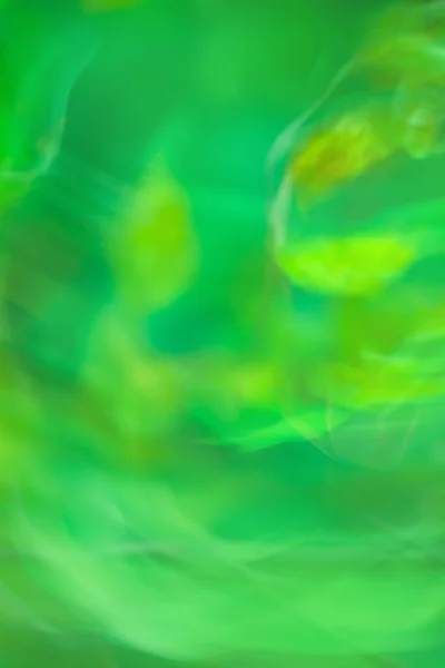 Blurred green motion minimalistic background. Bokeh abstract blurred green background with copy space