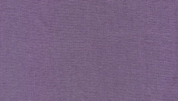 Knitted textured purple fabric background. Beautiful violet fabric texture.