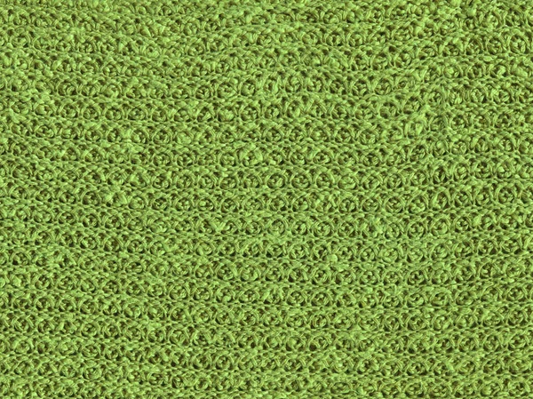 Green knitting wool texture full frame. Knitted green texture surface close up. Textile green material with wicker pattern