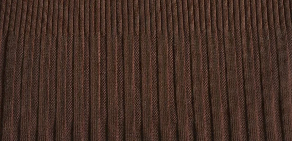 Pale brown knitting wool texture full frame. Knitted brown texture surface close up.