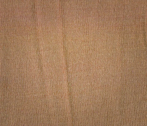 Knitted textured brown maroon fabric background. Beautiful olive brown vermillion fabric texture.