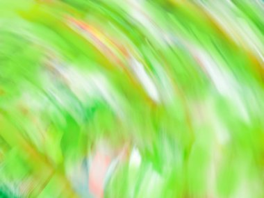 Soyut yeşil ışık girdabı. Işıklar dairesel yeşil desende hareket ediyor.