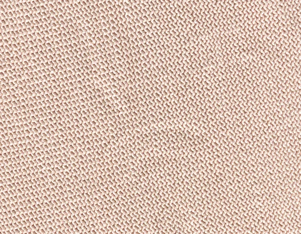 Merino beige wool knit texture for the design. Knitted woolen cotton fabric background in beige cream color.