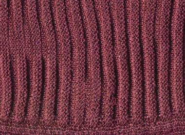 Kahve renkli yün süveter deseni. El yapımı kahverengi vermilyon örülmüş yün atkı dokusu